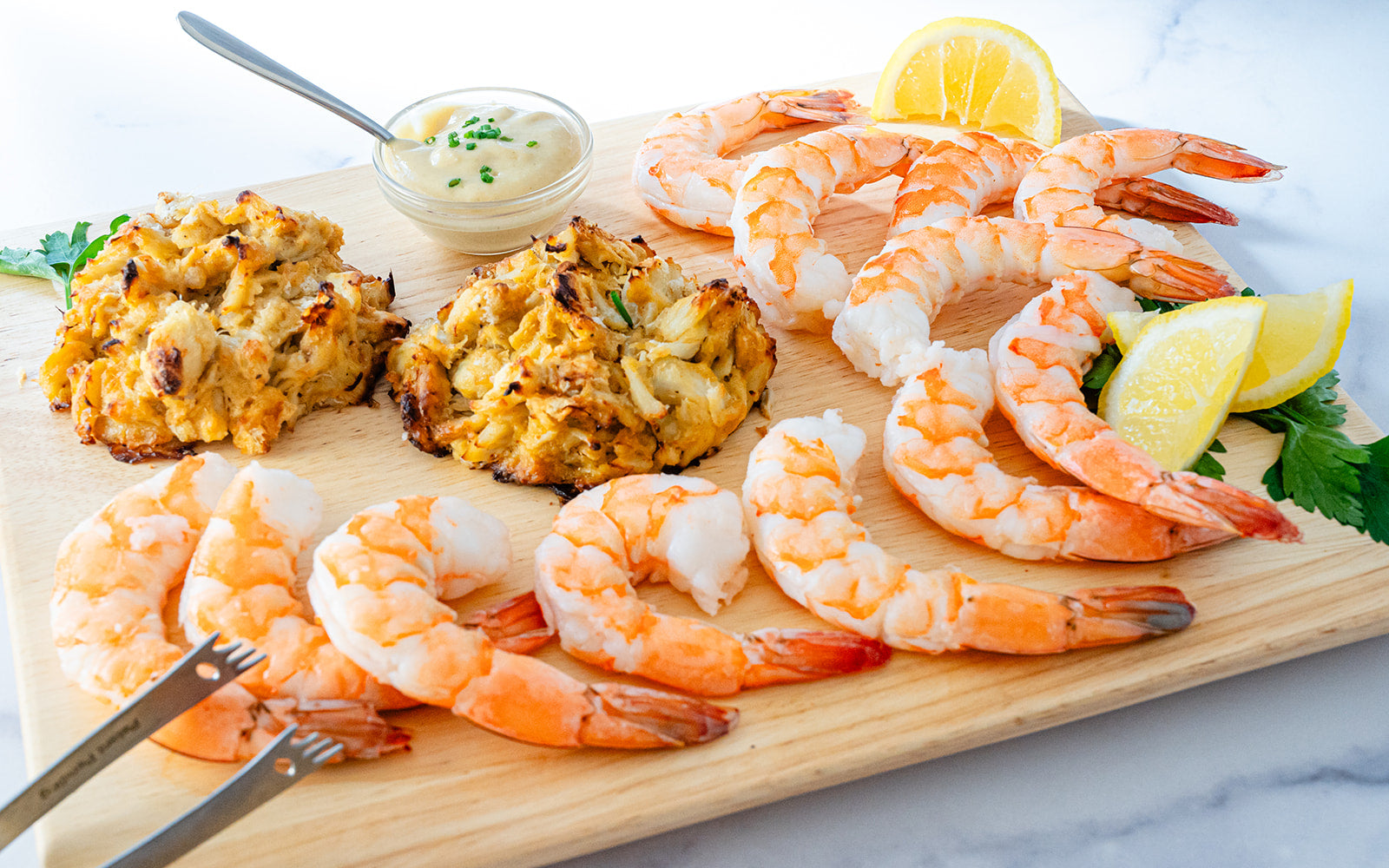 Crab cakes and shrimp cocktail appetizer sampler close-up