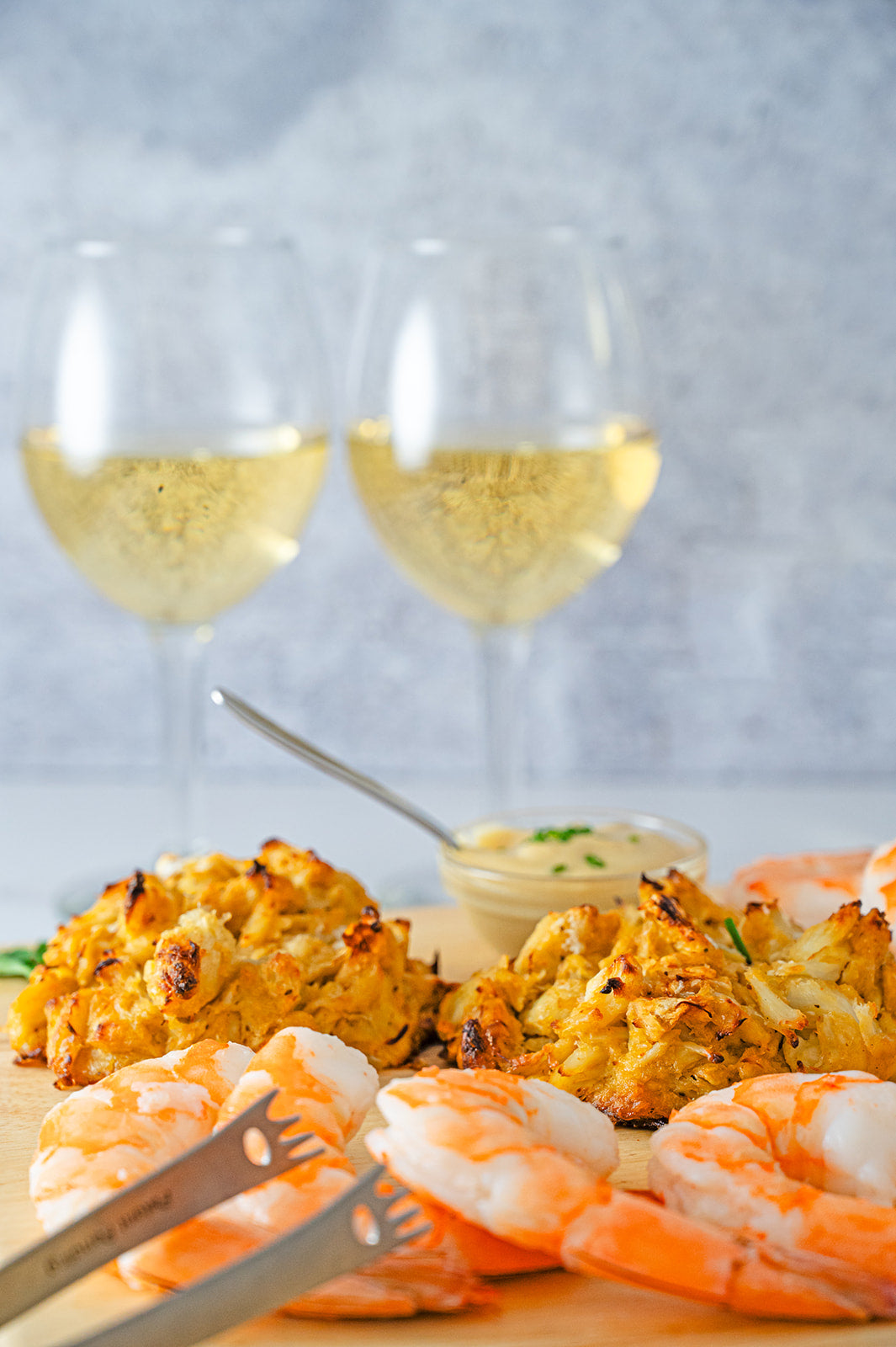 Crab cakes and shrimp cocktail appetizer sampler vertical