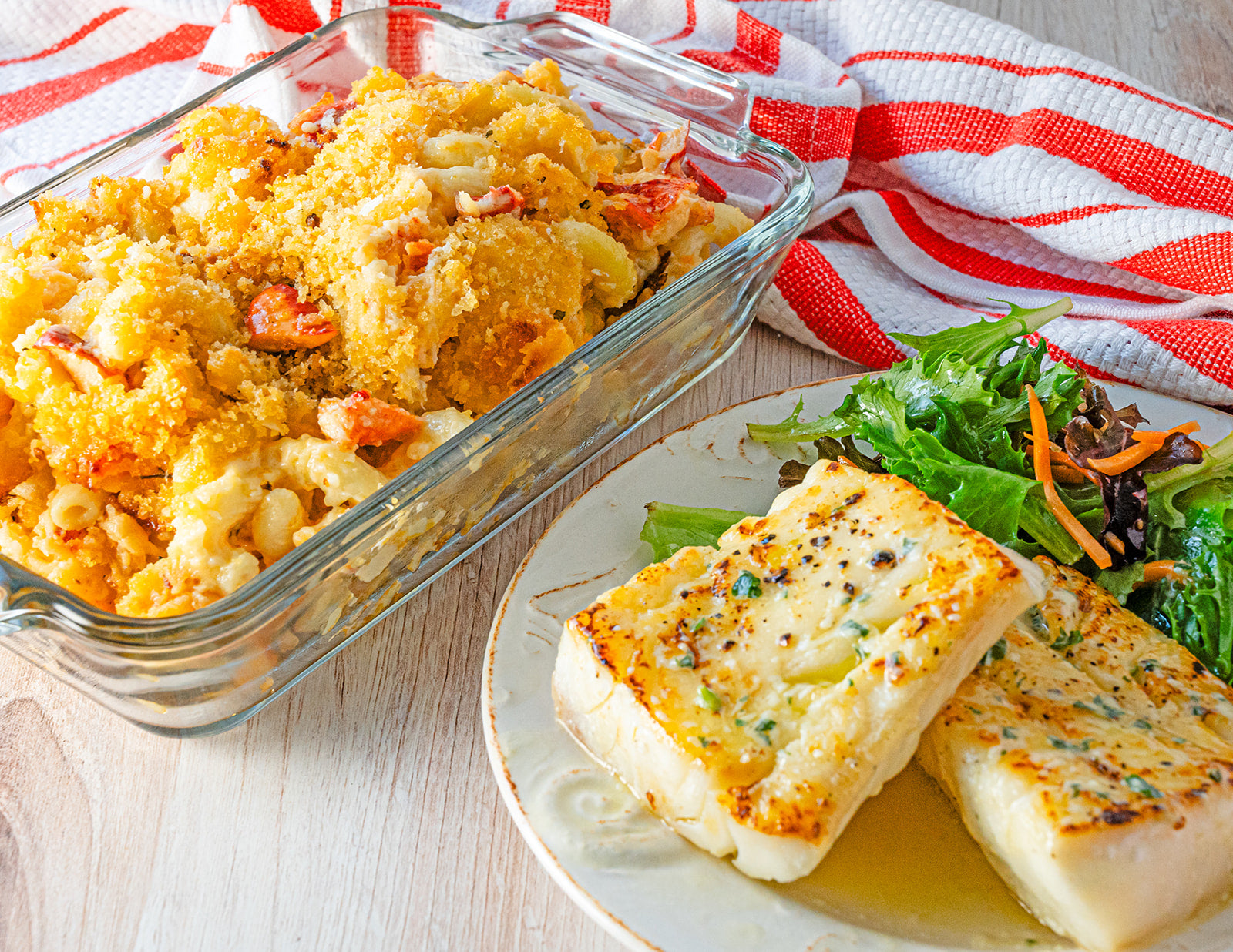Garlic herb cod and mac and cheese with salad